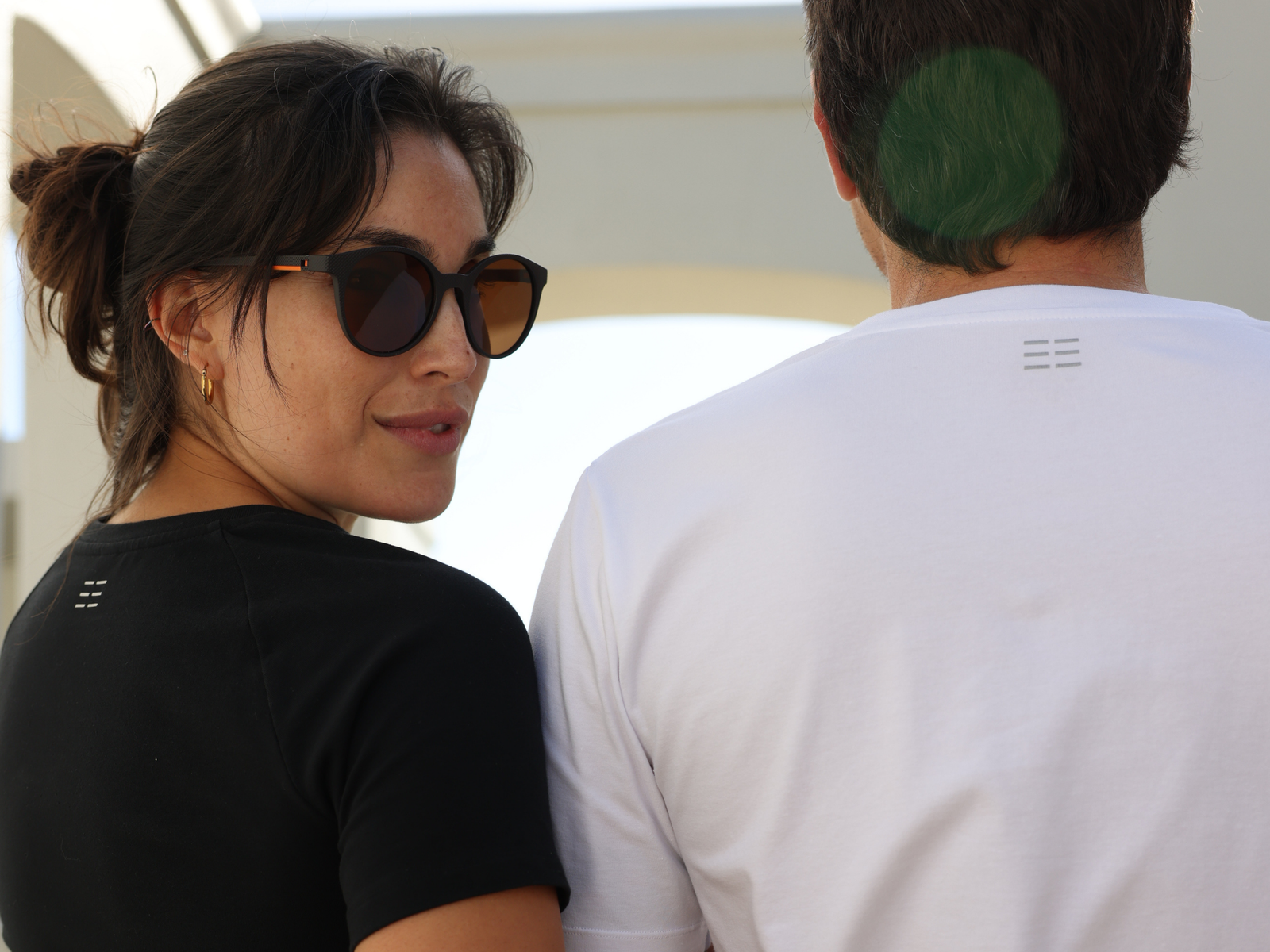 Man and Woman wearing premium quality BREETH Apparel T-shirts in plain black and plain white