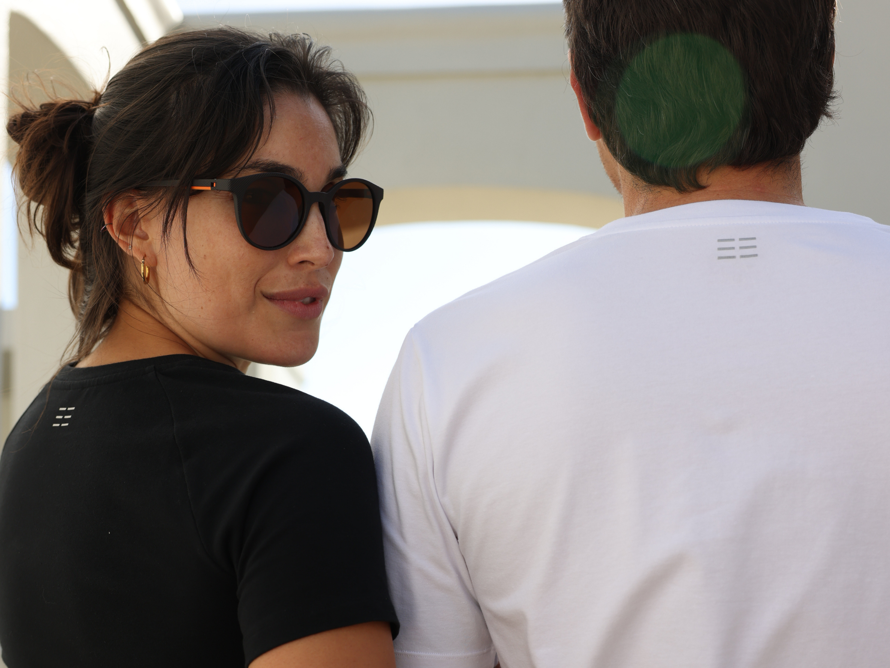 Man and Woman wearing premium quality BREETH Apparel T-shirts in plain black and plain white