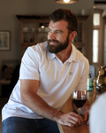 Man wearing breathable white cotton polo shirt made from Oeko-Tex fabric in South Africa by BREETH